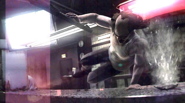 Lynch vaulting over a counter while bullet impacts spark near him.